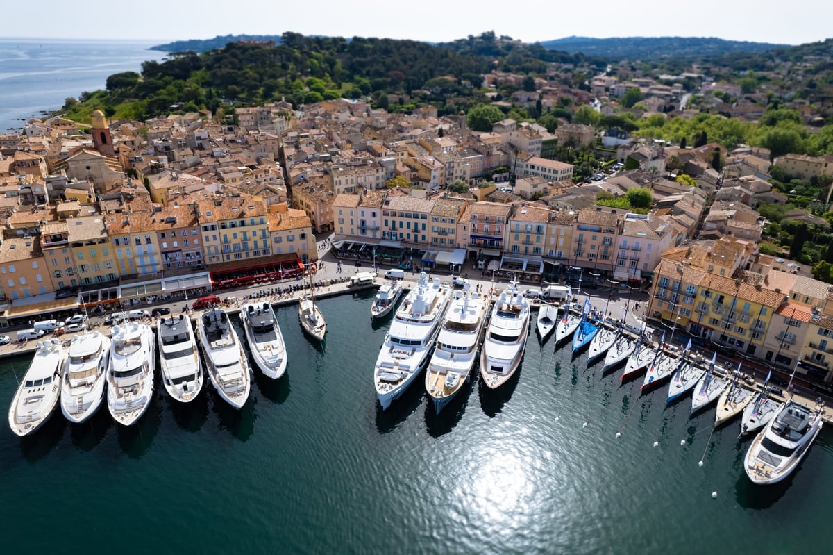 Aerial view of Saint Tropez with Mega Yachts and Sail boats