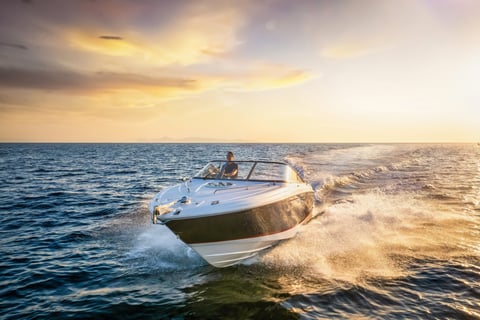 Sports motor boat at sunset