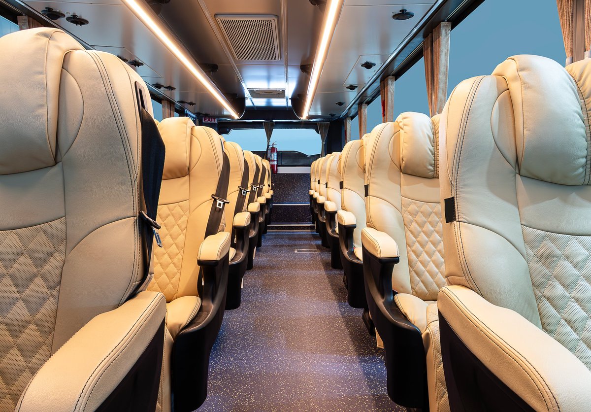 Inside luxury bus with brown reclining leather seats