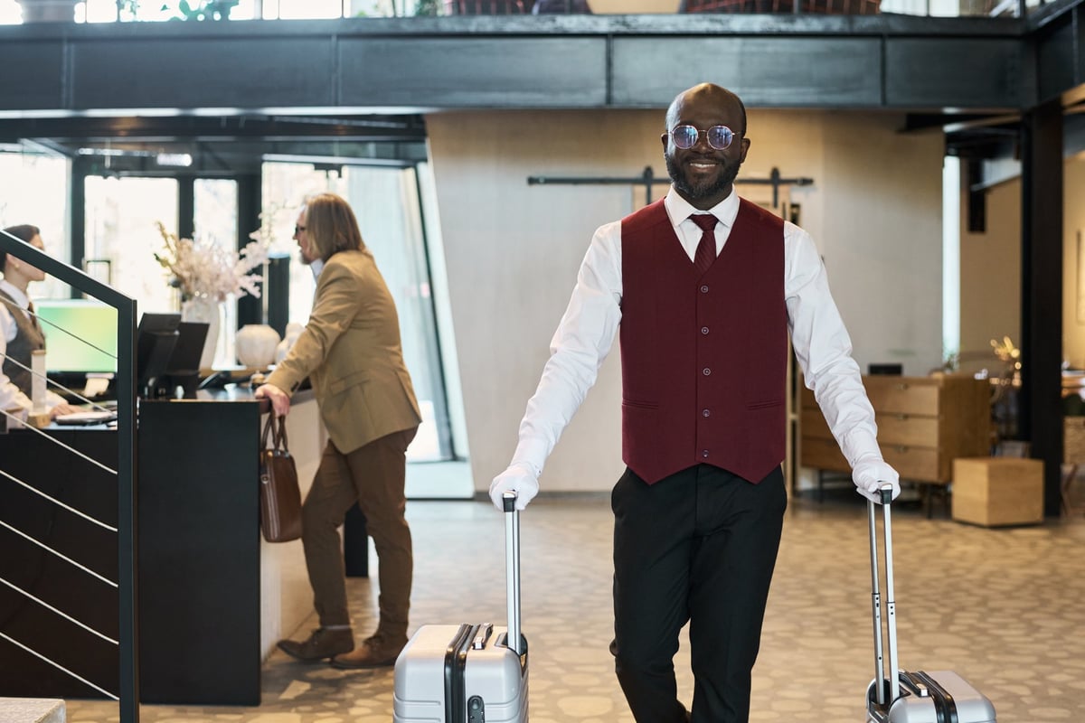 Airport staff member handling luggage