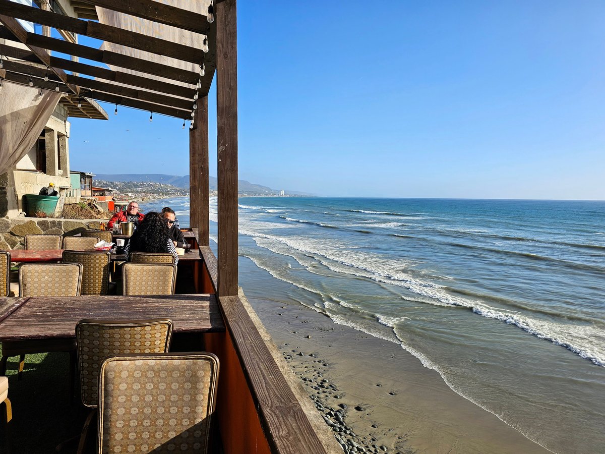 Beachfront restaurant with coastal decor and elegant outdoor seating