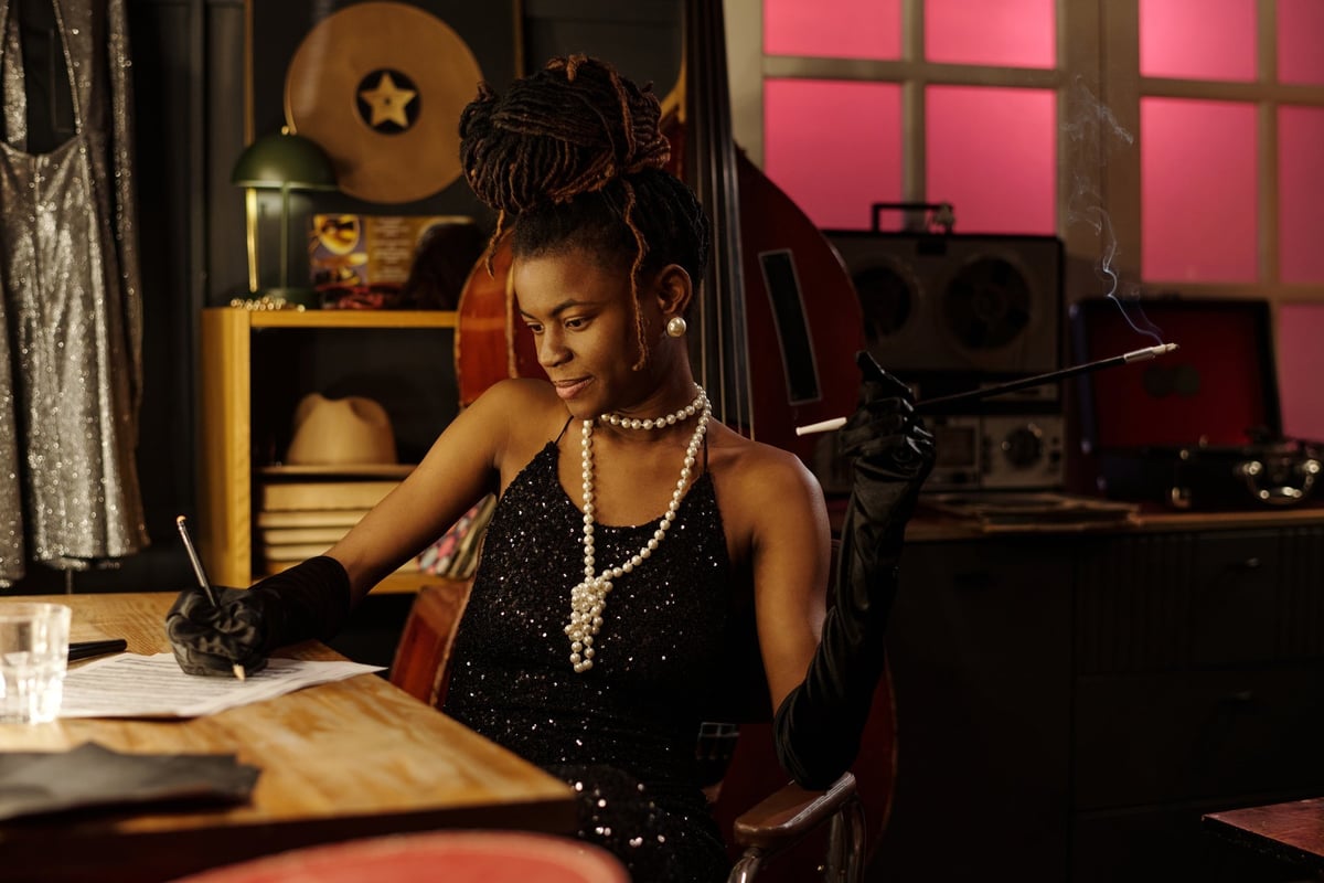 Elegant woman at table in jazz club setting