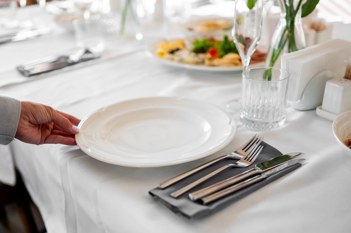 Formal dining table with cutlery and glass
