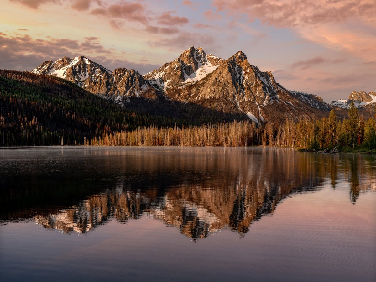 Sawtooth mountains bathed in warm sunrise light in Aspen Colorado