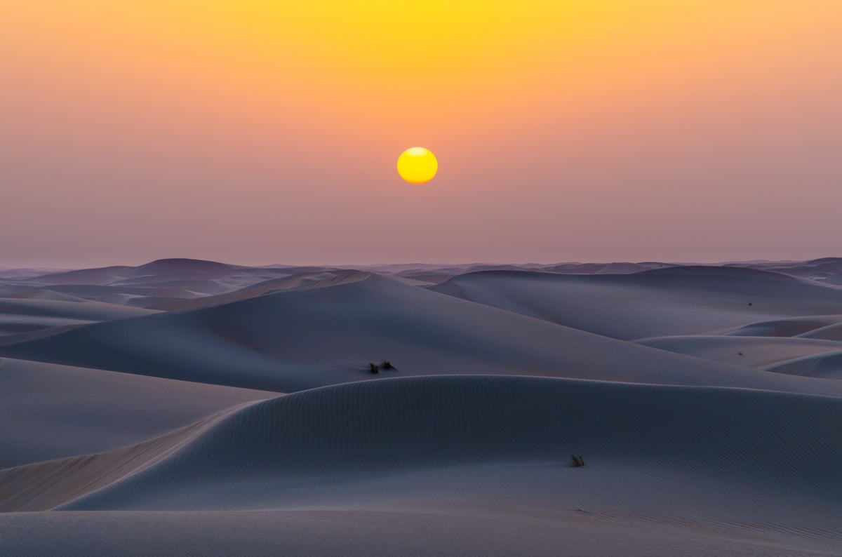 Dubai desert sunset luxury camp experience