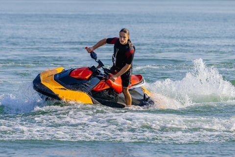 Man riding jet ski turquoise waters