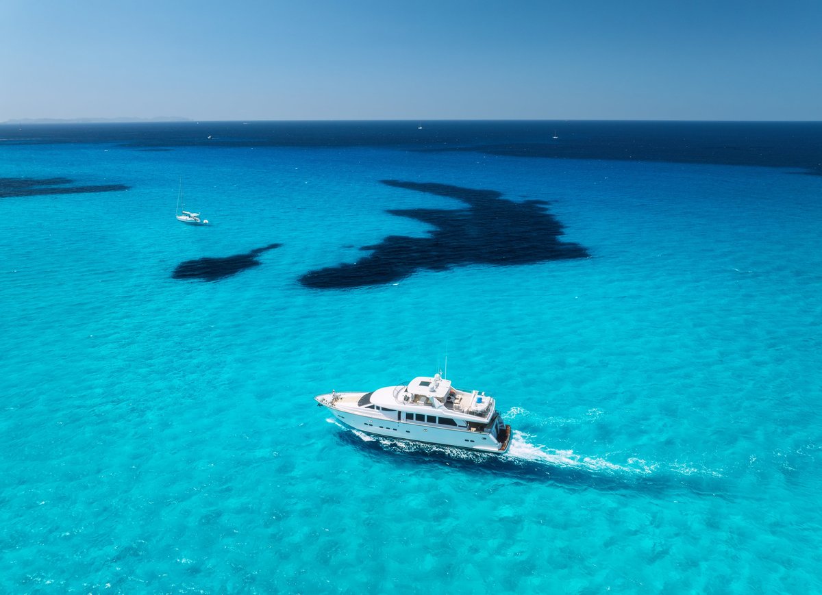Aerial view luxury yacht turquoise sea Mallorca