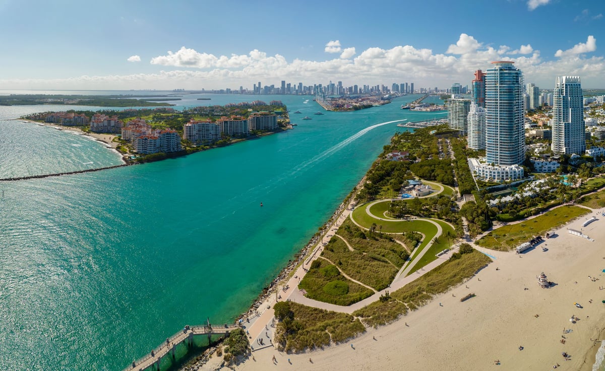 Miami Beach city skyline with high luxury hotels and condos and sandy beachfront