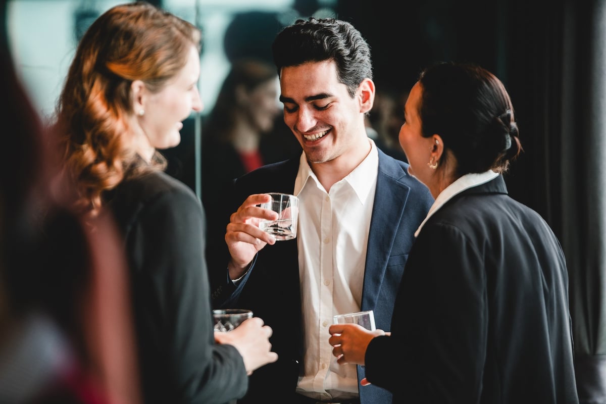 Business professionals gather after work for drinks and casual conversation