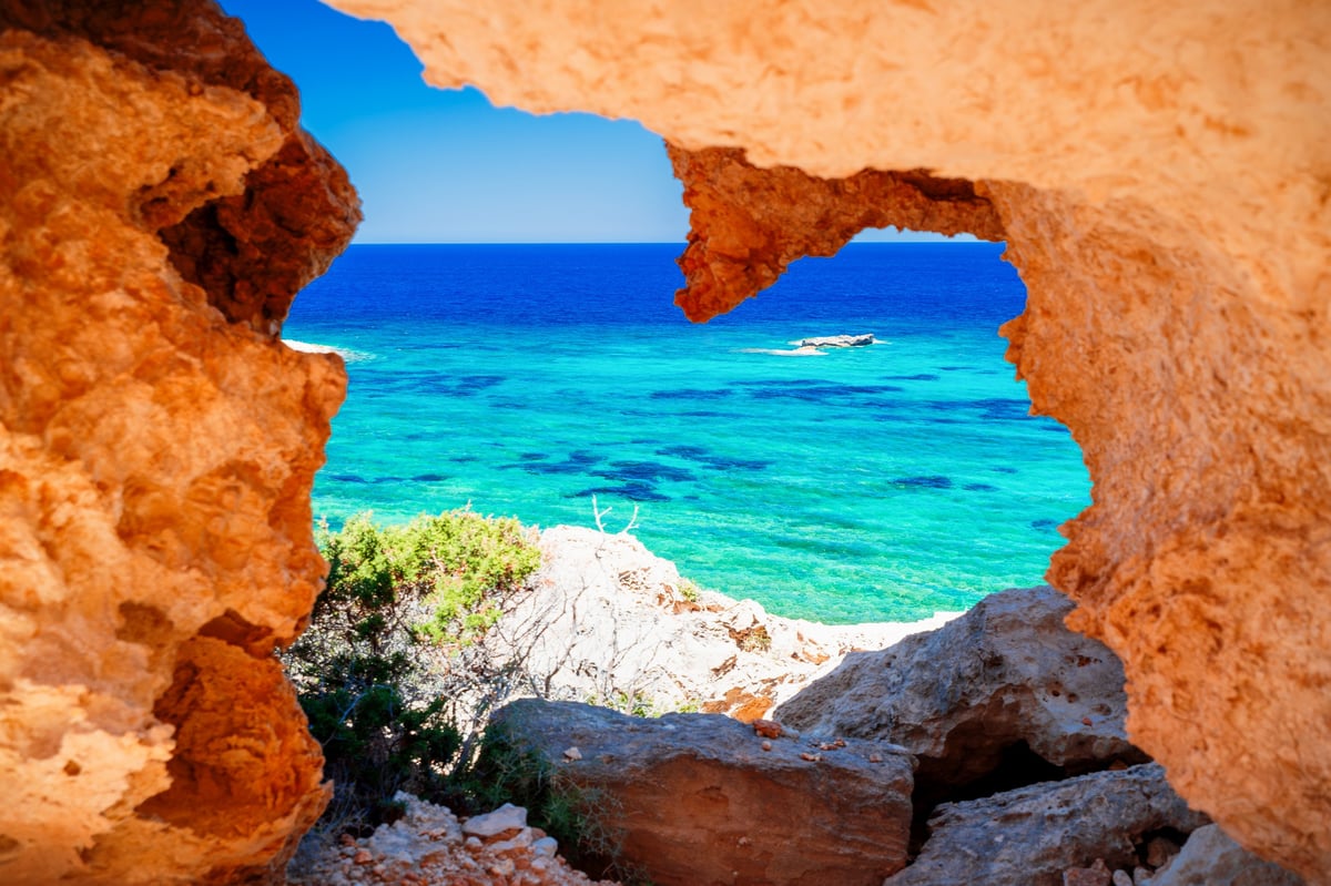 View over the rock towards the turquoise Mediterranean Sea, Peyia, Cyprus. Natural frame, holiday postcard.