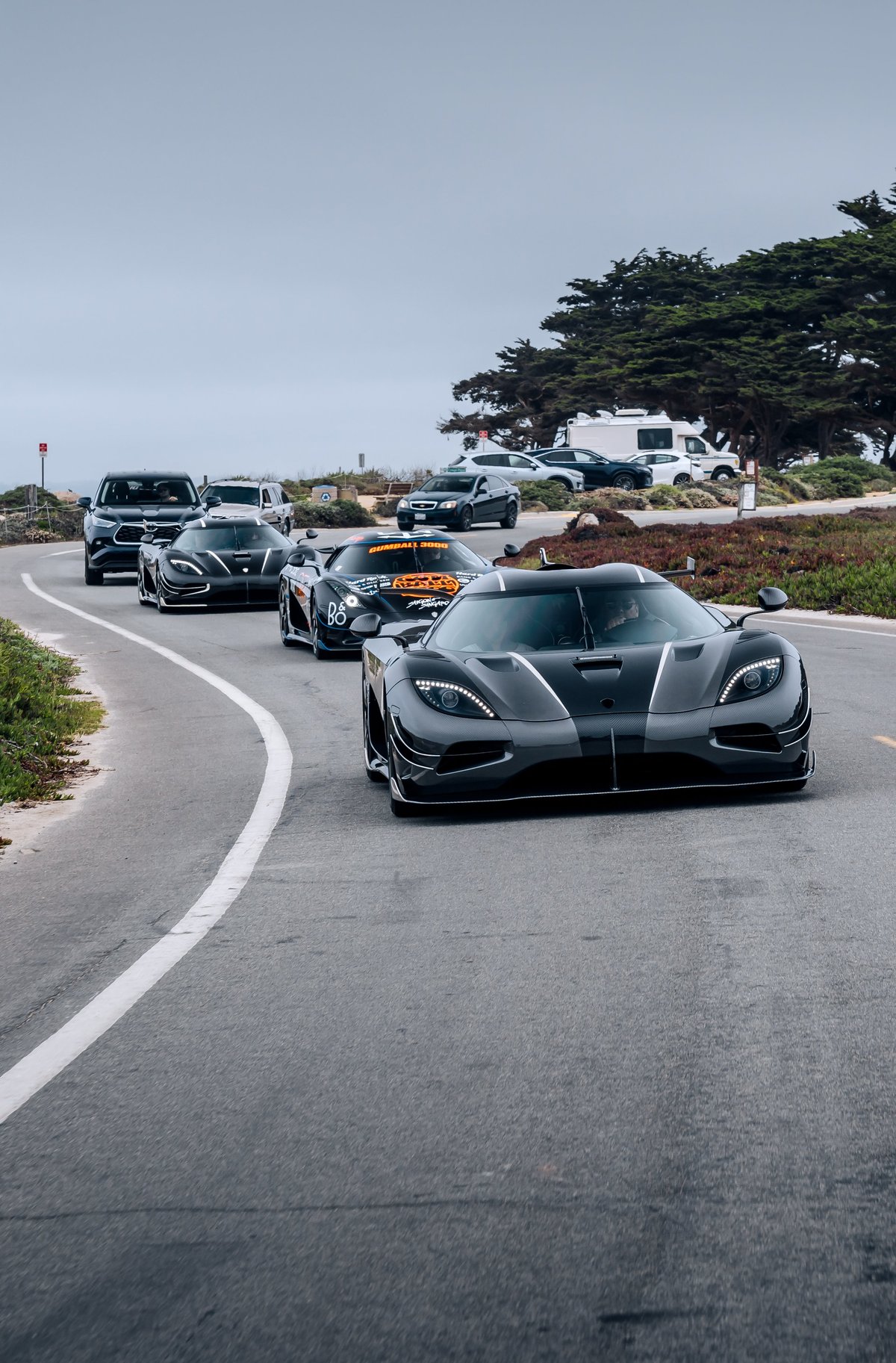 Supercar convoy driving on highway