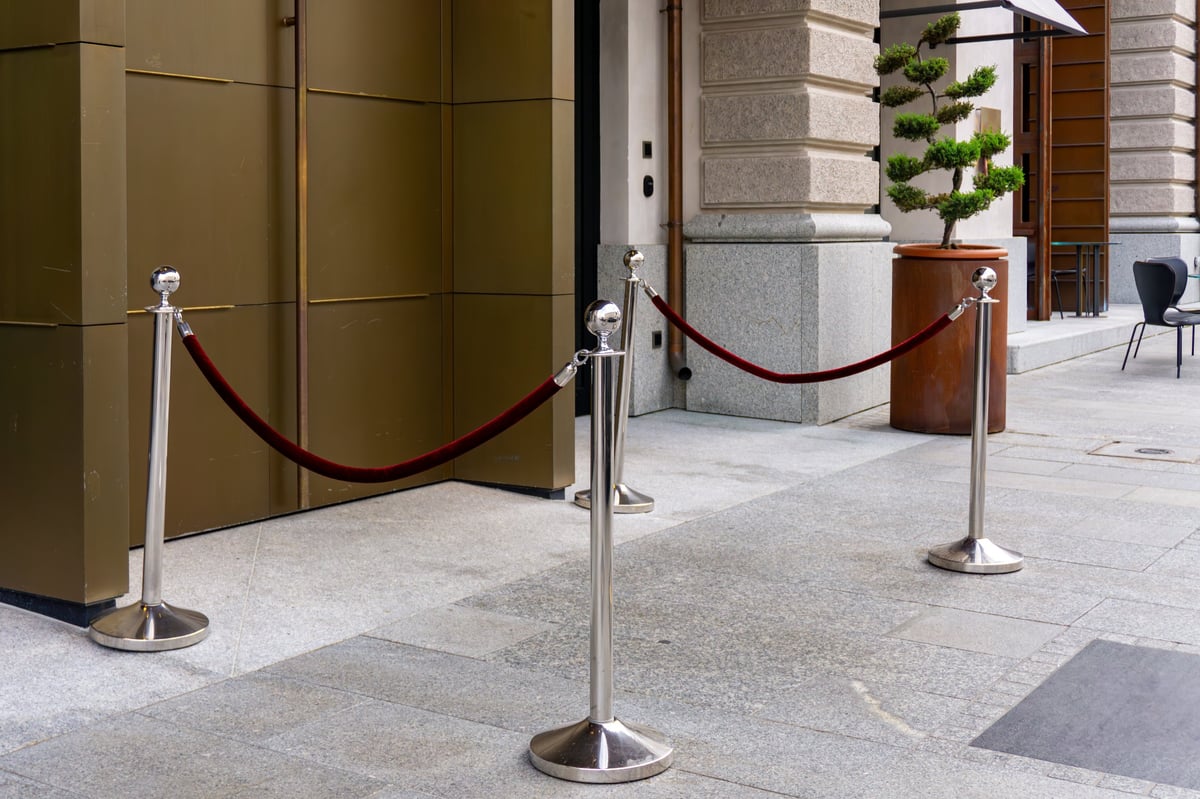 Red rope stanchions at luxury hotel entrance