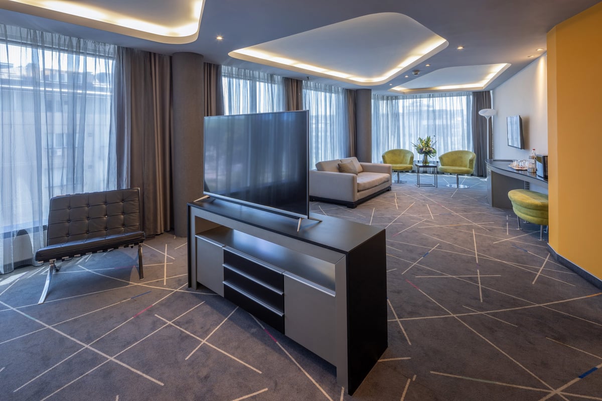 Spacious modern luxury suite interior with premium furnishings