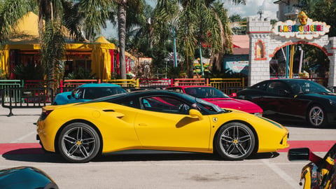 Exclusive sports car rally featuring Ferraris Lamborghinis and Maseratis