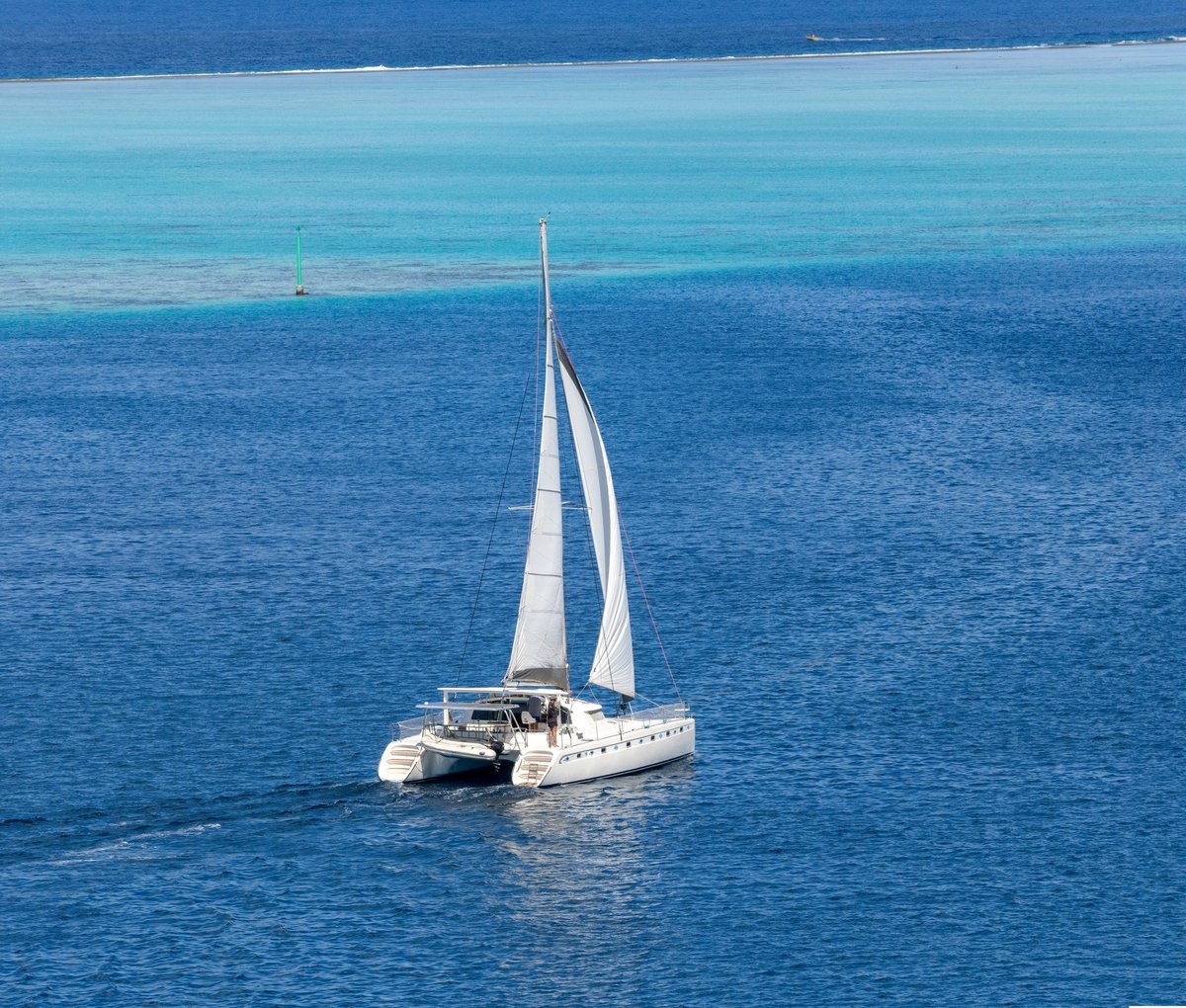 Catamaran sailing in the Raiatea lagoon, Society Islands, French Polynesia