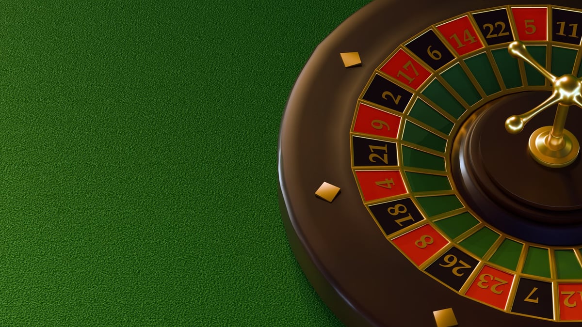 Dark-toned casino roulette wheel with red and black sections
