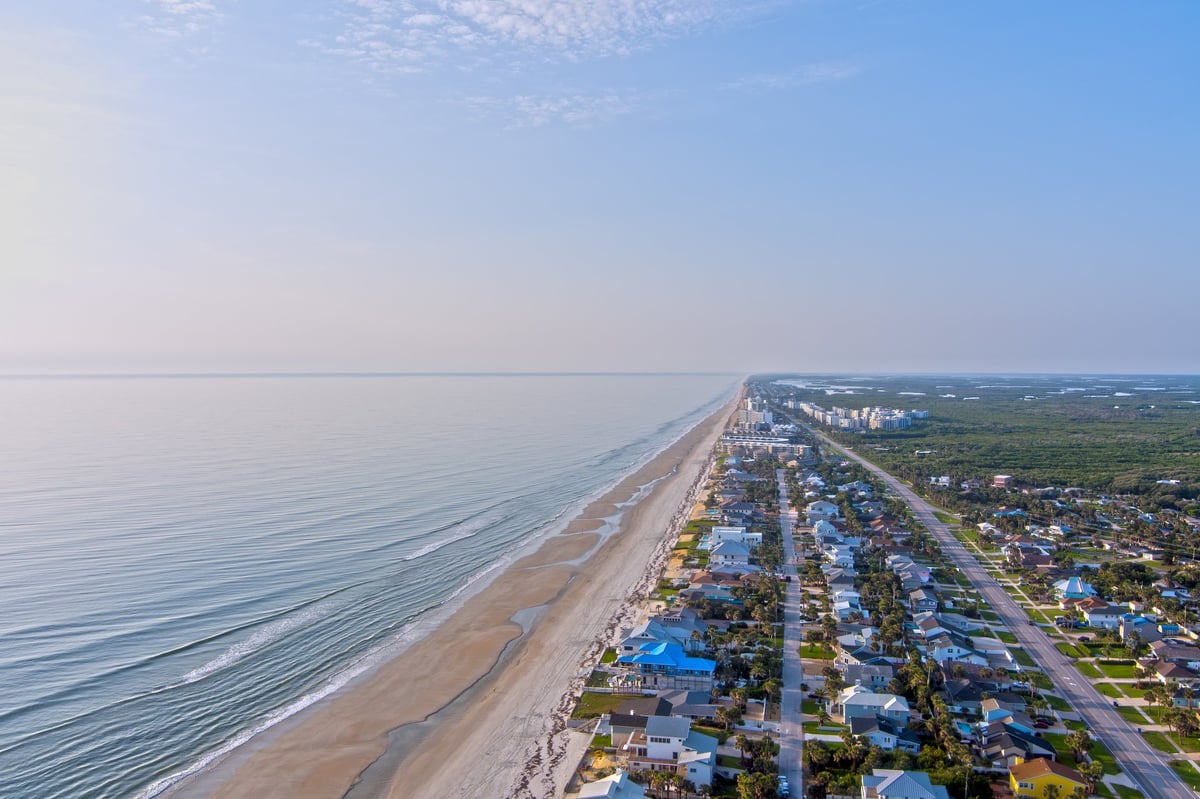 Aerial view of coastal waterfront at sunrise