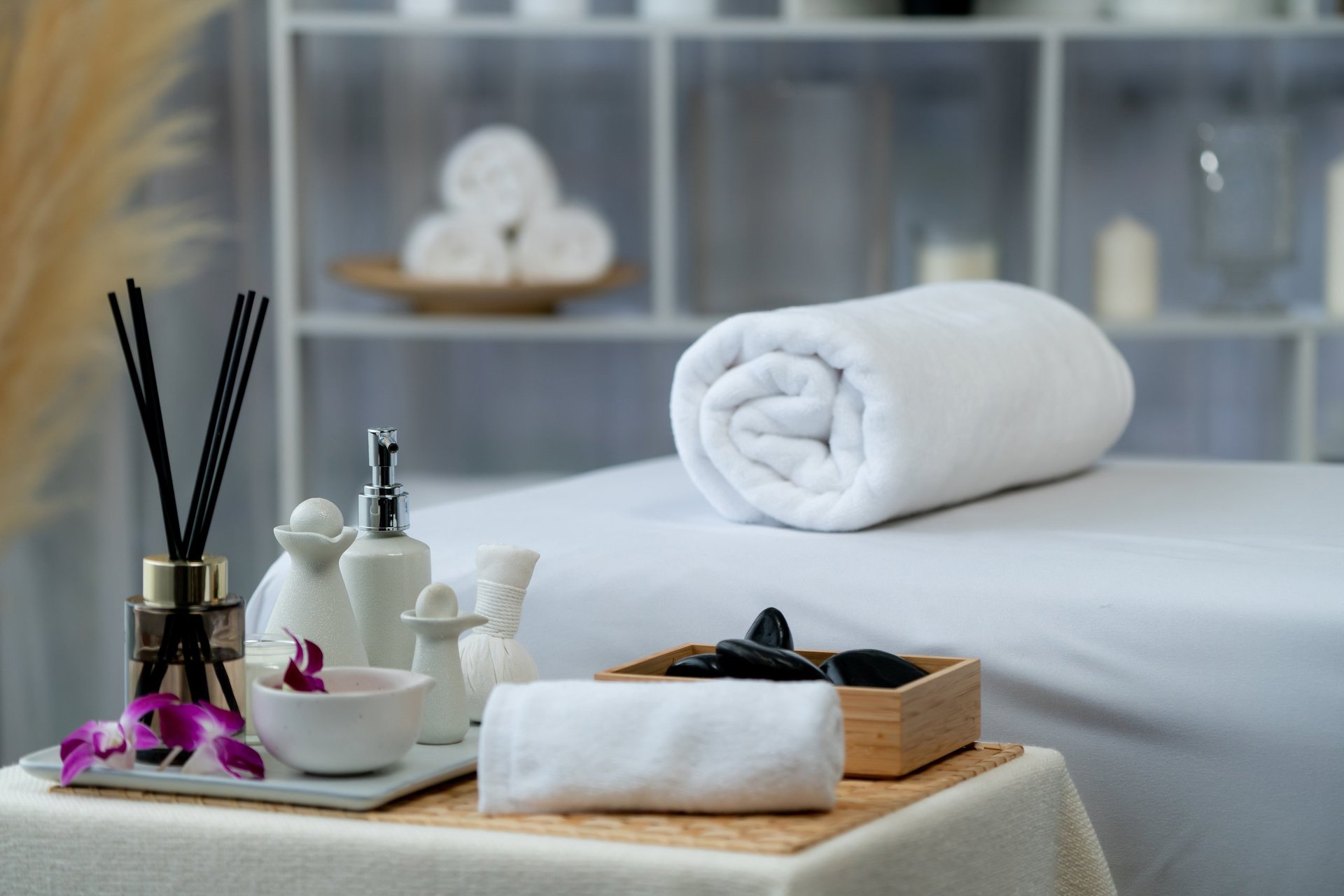 Exquisite display of beauty treatment and spa salon accessories arranged on spa table in luxury spa resort