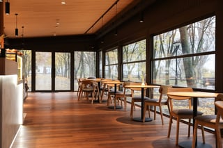 Stylish restaurant with large windows and comfortable furniture