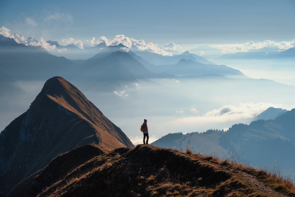 Hiking in the French Alps during summer with panoramic mountain views