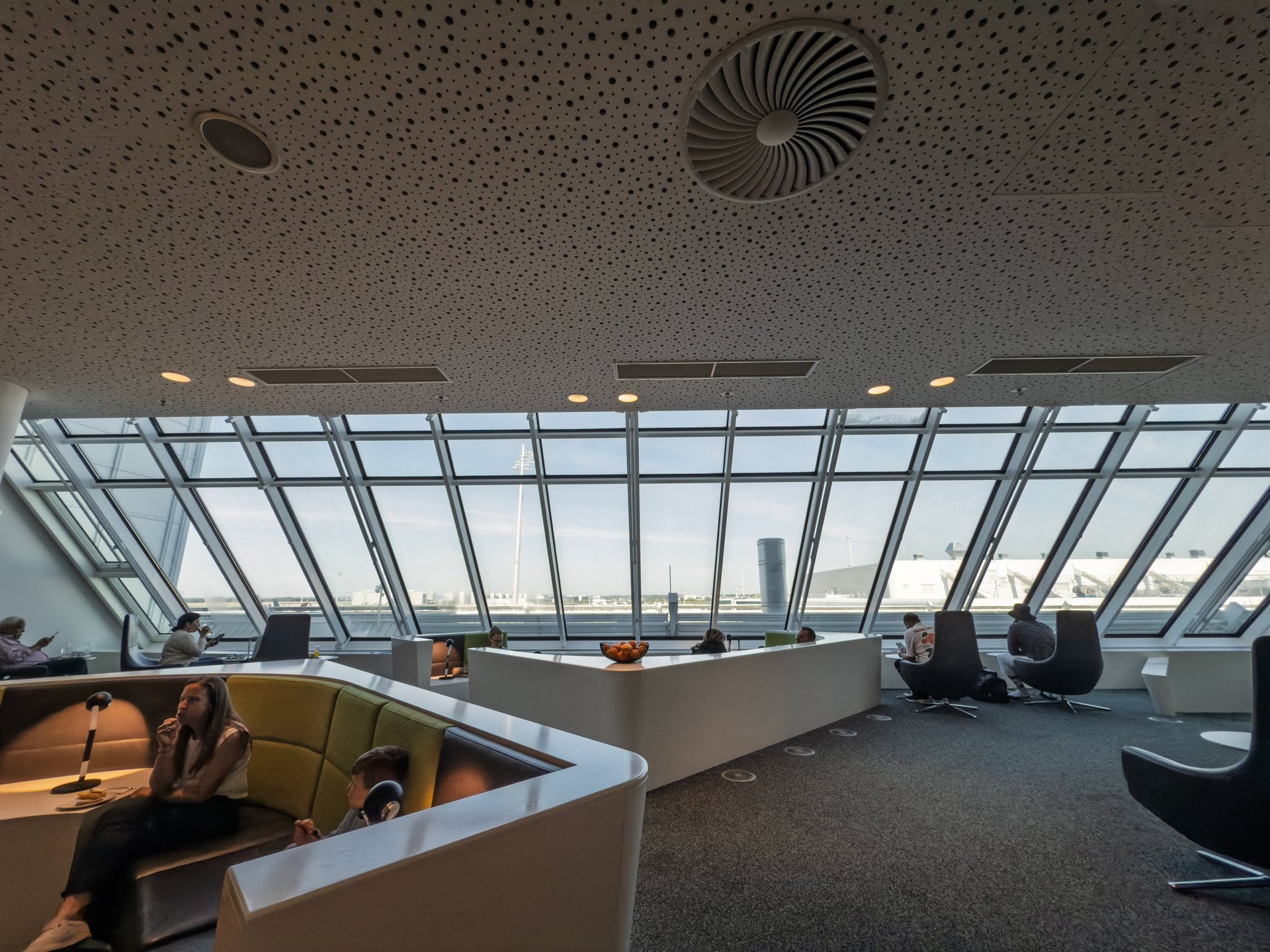 Luxury airport VIP lounge interior with elegant seating and panoramic runway views