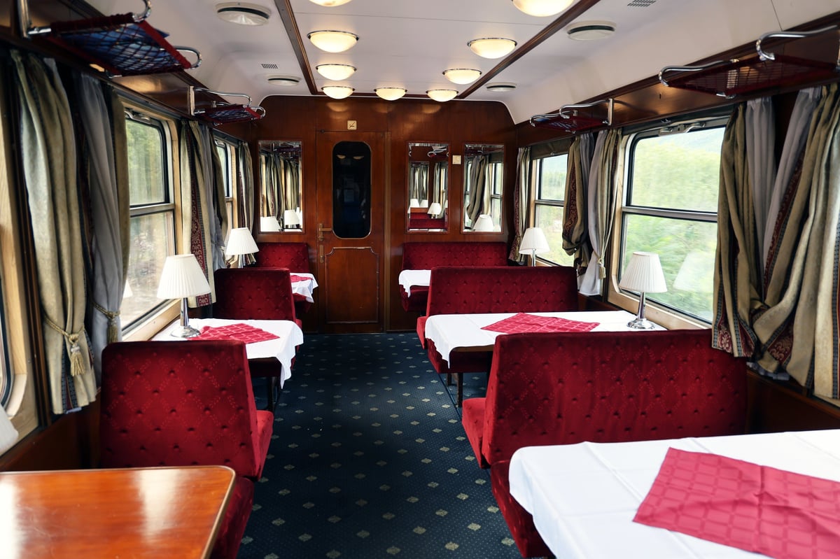 Budapest-Split Adria intercity dining car with elegant tables and white tablecloths