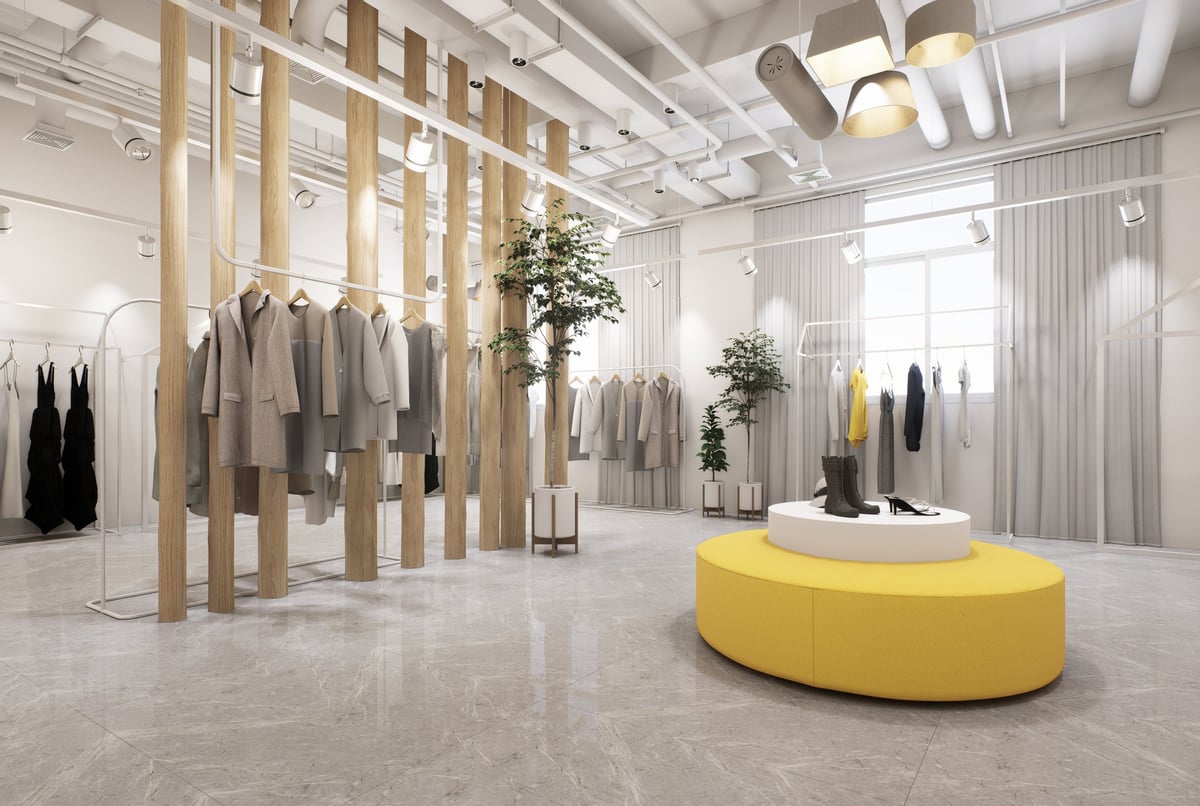 Modern minimalist clothing store interior with industrial ceilings