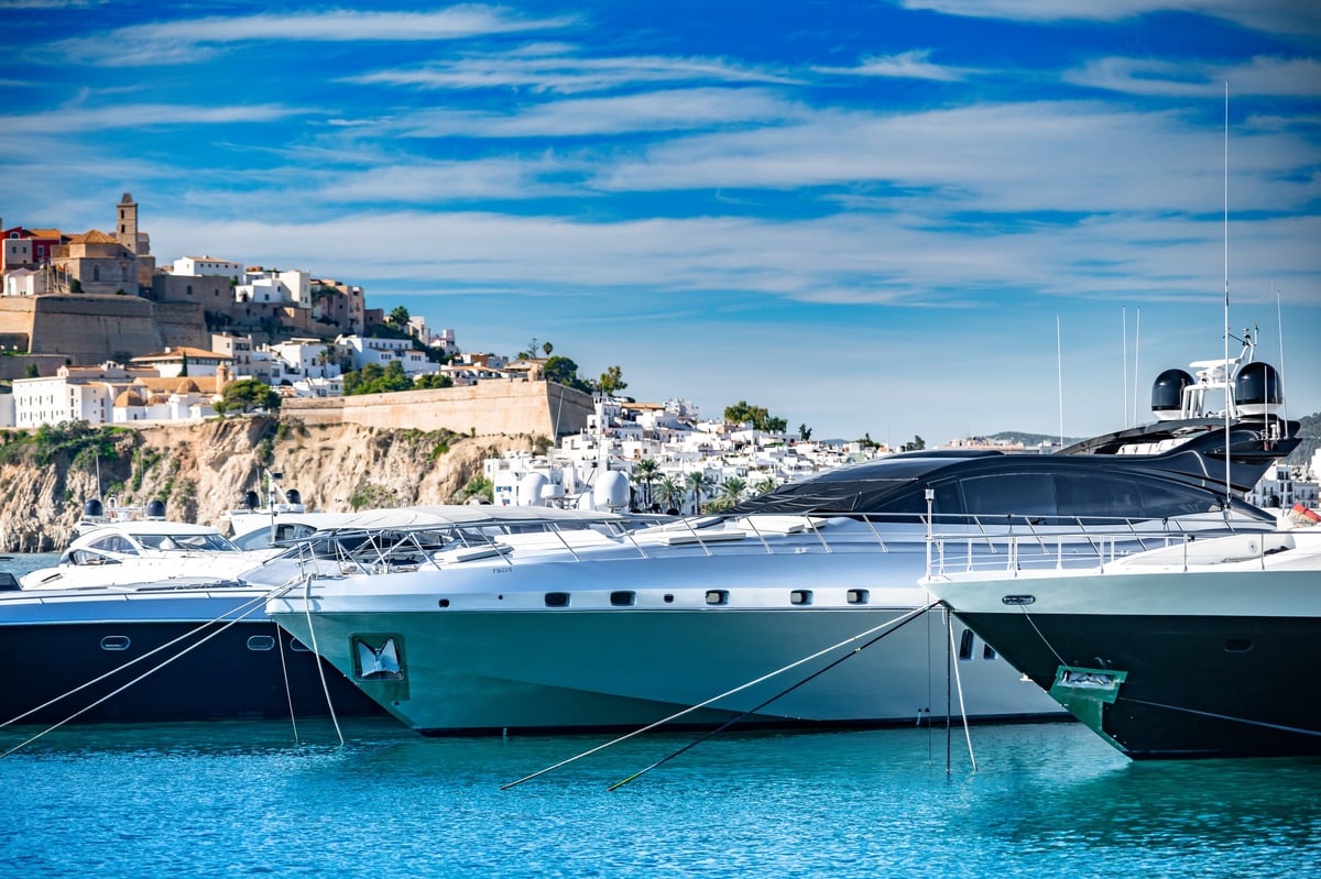 Luxury Yachts Moored in the Historic Ibiza Old Town Marina, Bathed in Mediterranean Sunlight