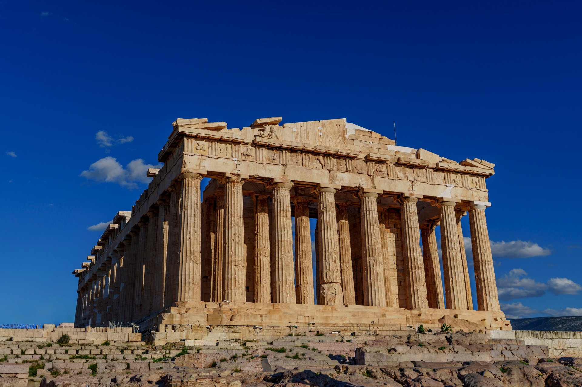 Majestic Parthenon with its impressive Doric columns, standing atop the rocky Acropolis hill