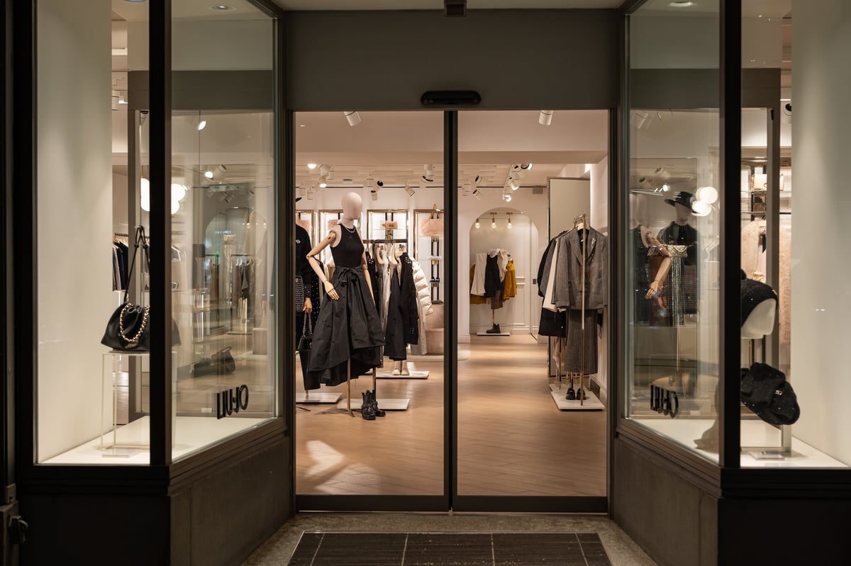 Zurich luxury boutique store front window with female mannequins dressed in stylish outfits