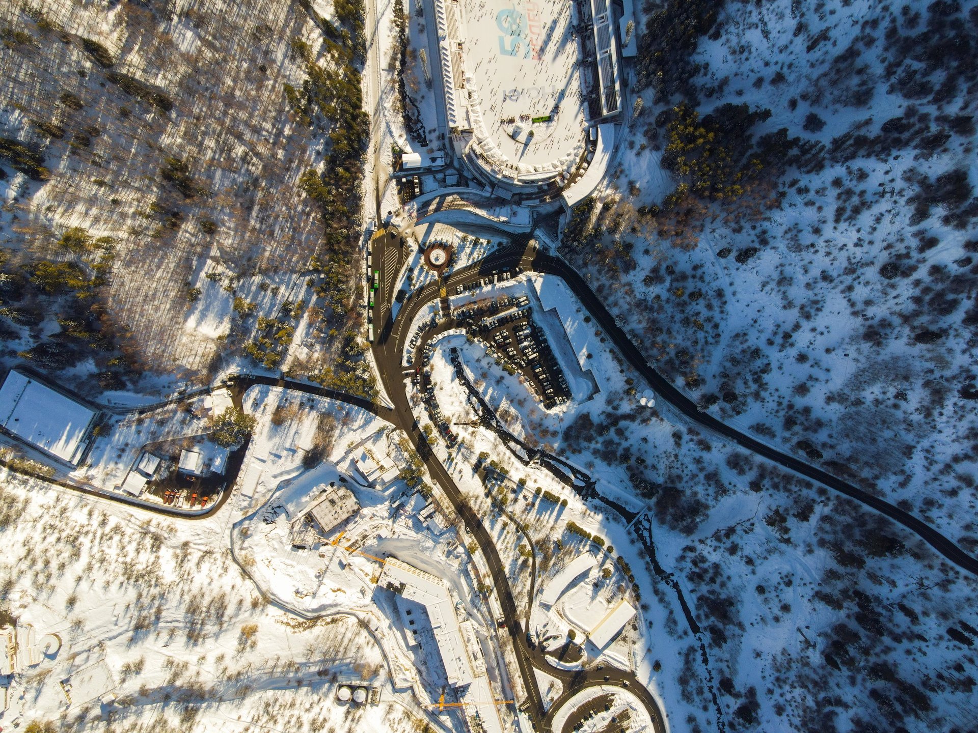 Aerial view of luxury ski resort in snow covered alpine mountains