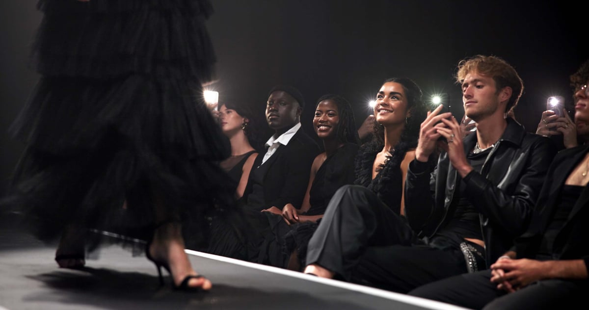 People, audience and catwalk with phone for fashion show, garment collection or designer brand