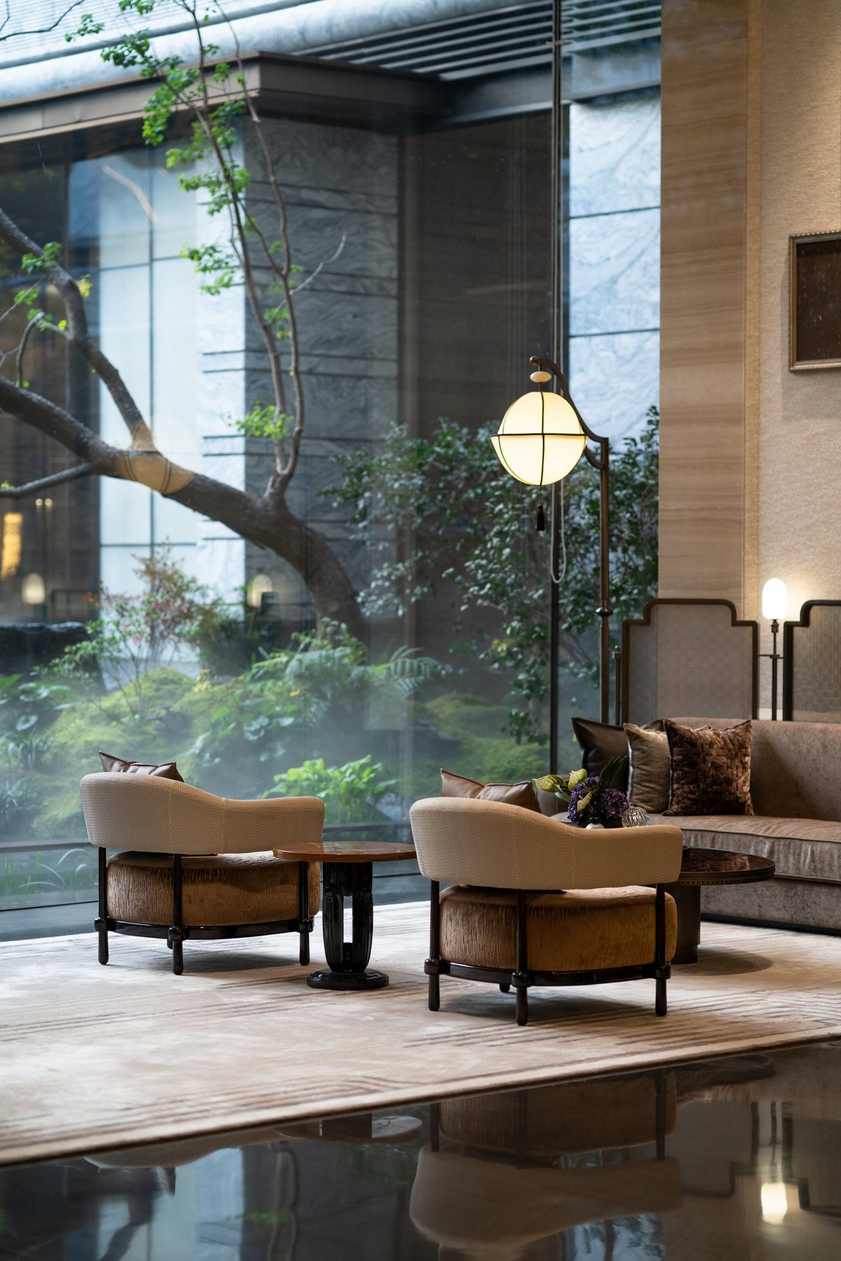 Cozy armchairs in elegant alpine lounge with mountain views