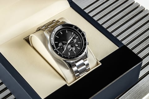 Modern men's wristwatch with black dial and elegant design