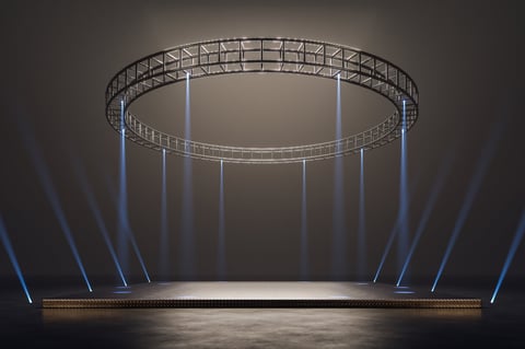 Concert stage with dramatic lighting and spotlights