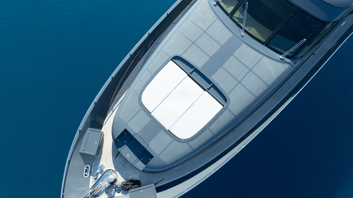 Luxury Yacht on the Open Water, cruising across calm blue waters