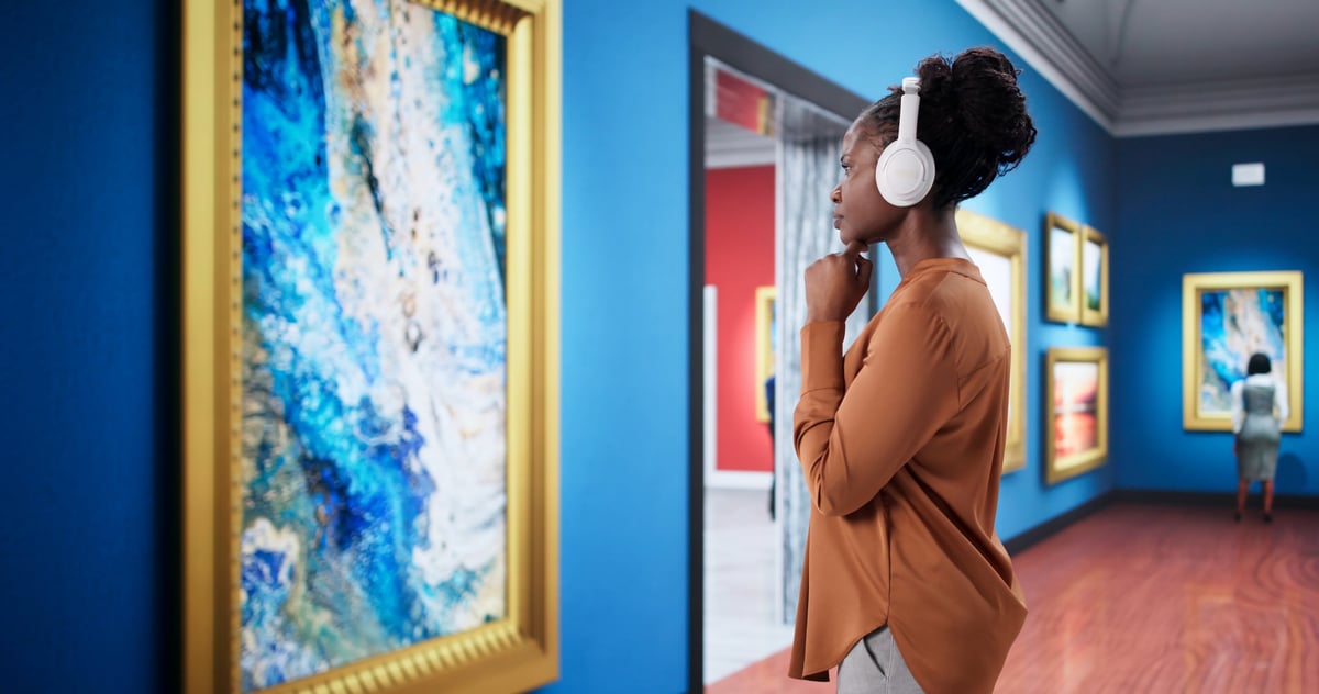Person admiring artwork in gallery, luxury art collection and commissions