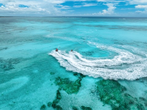 Aerial view of jet skis over turquoise sea