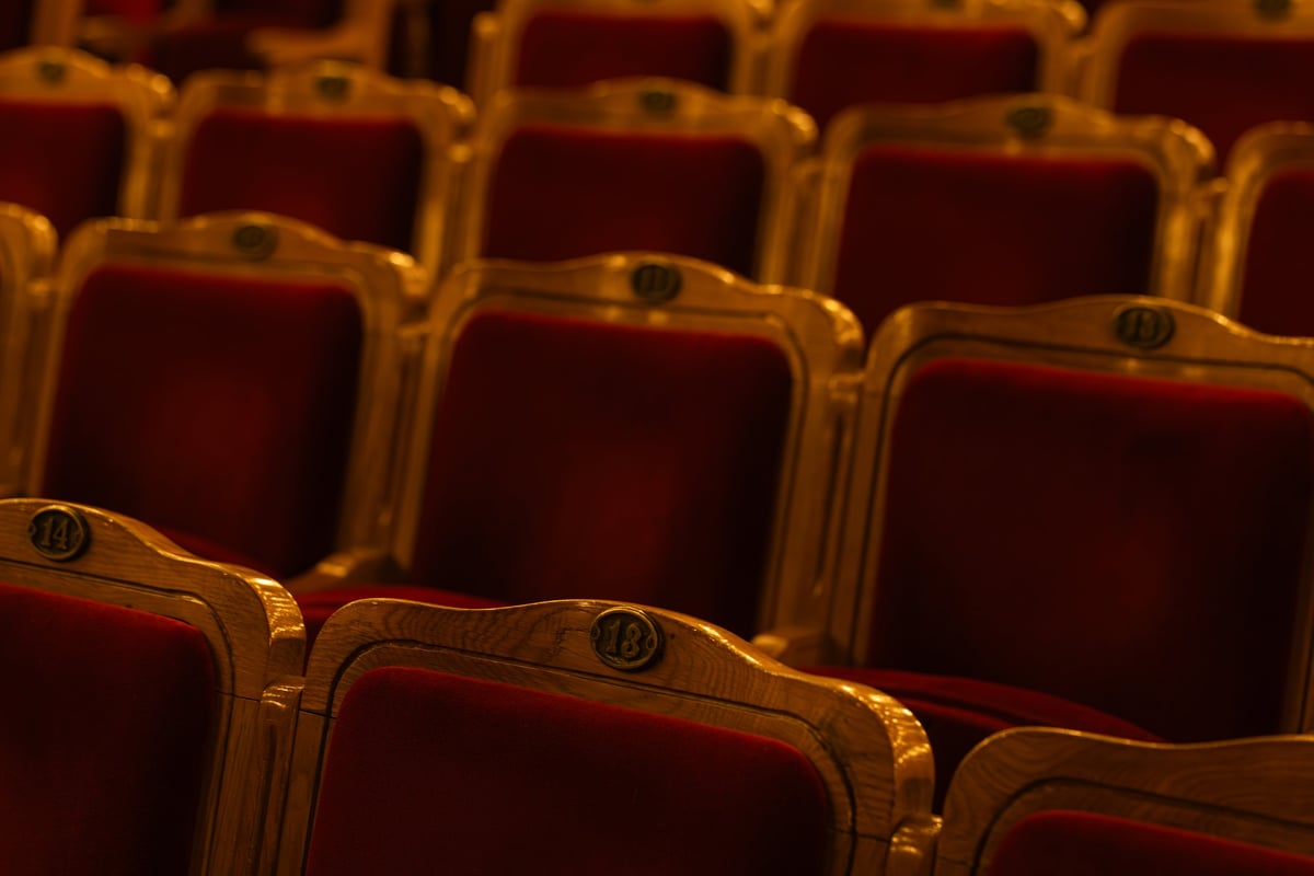 Vintage red velvet theater seats at La Scala opera house Milan