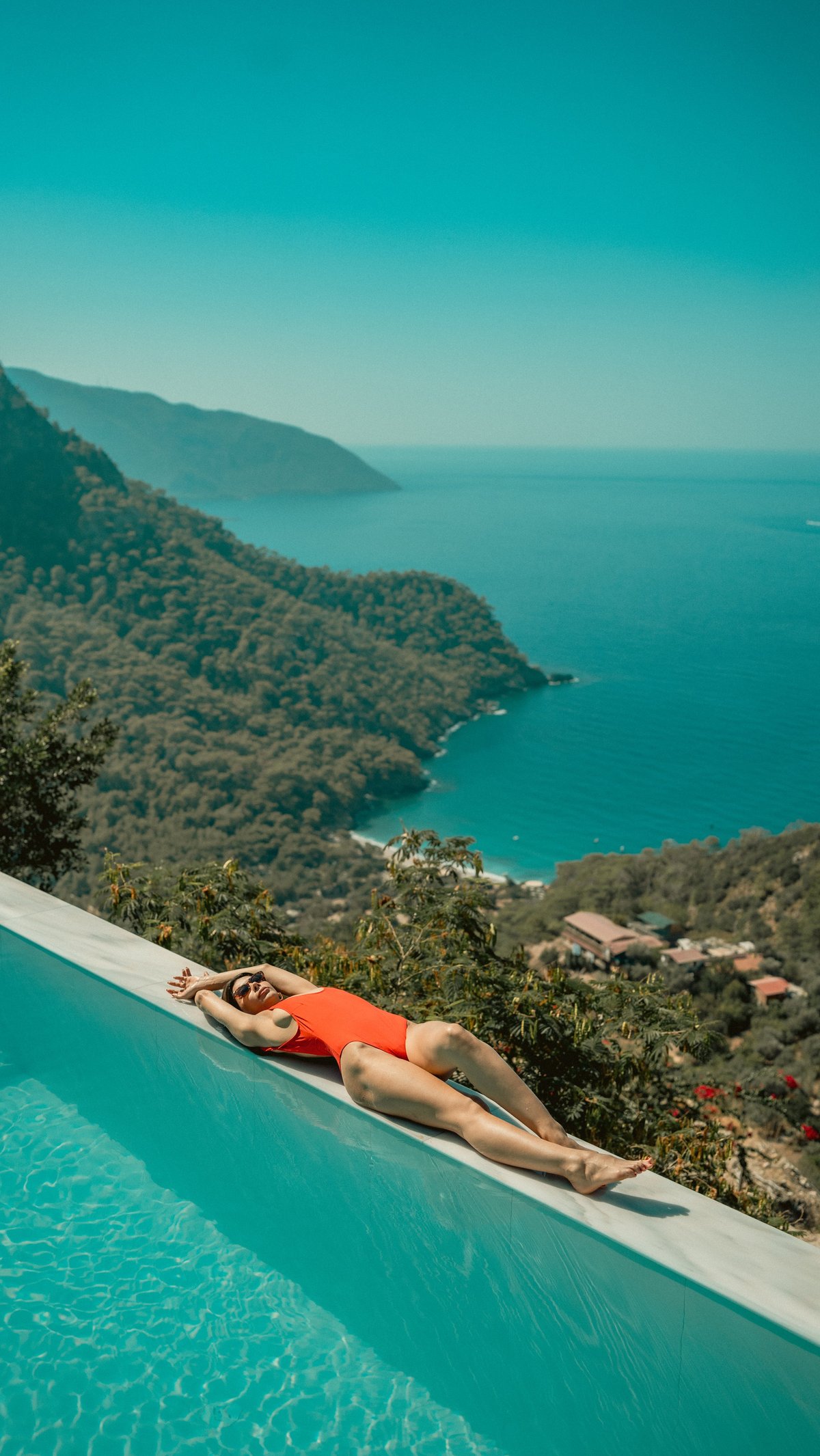 Luxury infinity pool overlooking tropical Bali coastline