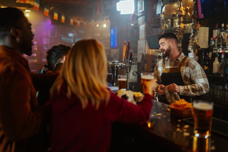 Bartender serving drinks at a luxurious bar