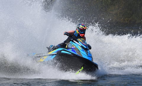 Jet Ski racing at speed spray