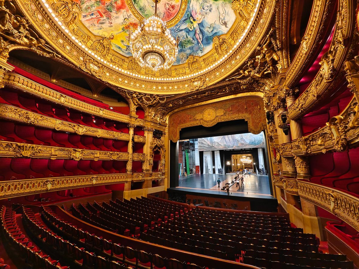 Palais Garnier auditorium in Paris with red velvet seats and ornate golden gilding