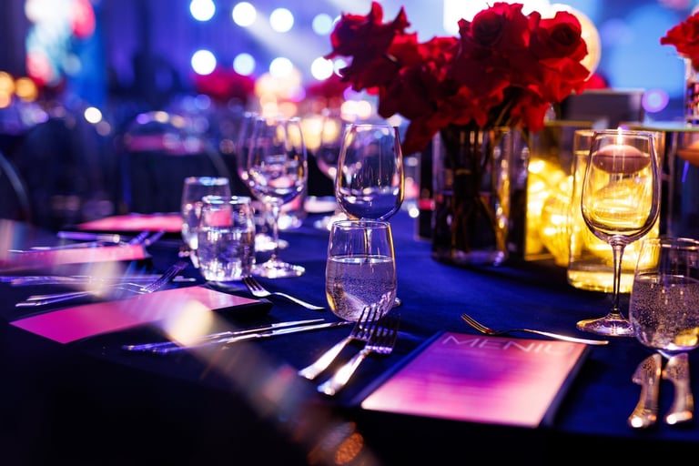 Formal banquet table with elegant settings and floral arrangements