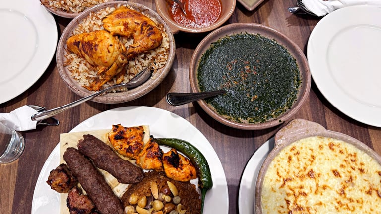 Egyptian dishes: Molokhia, rice with vermicelli, chicken, and side dishes