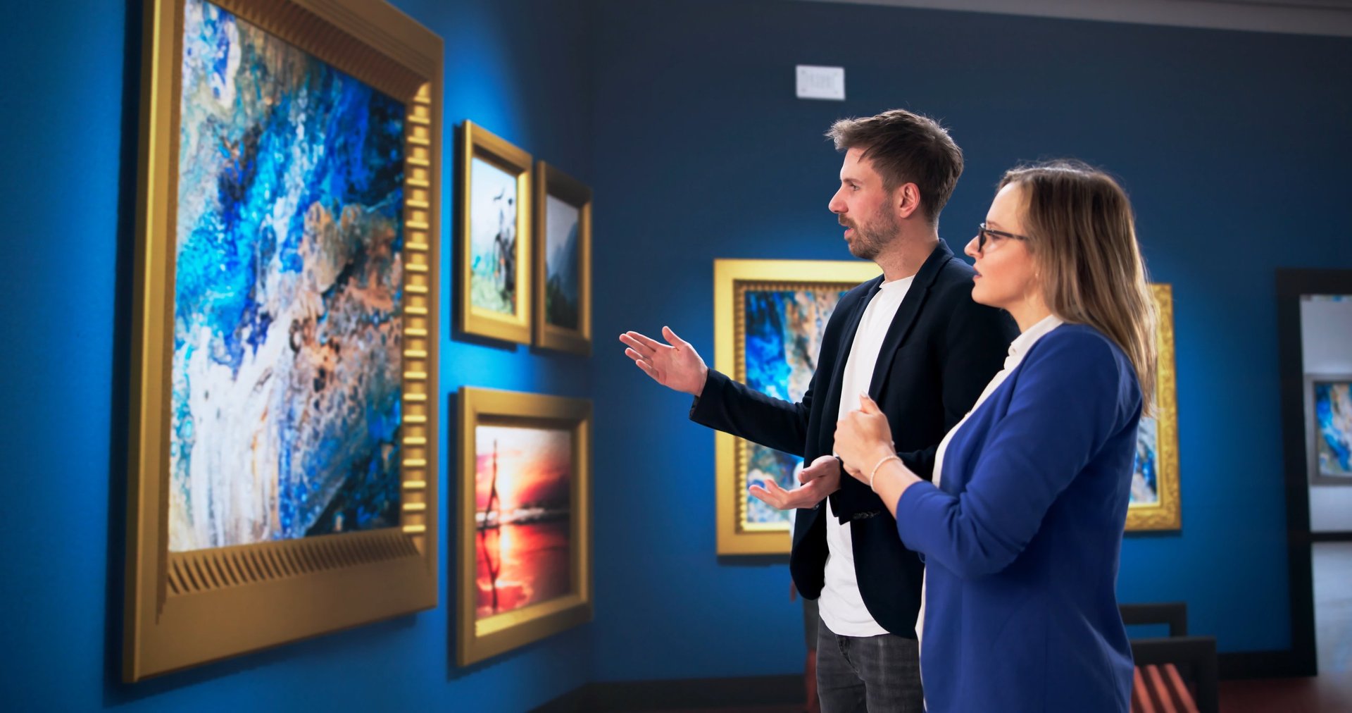 Curator Closely Observes Artwork At A Crowded Gallery Exhibition