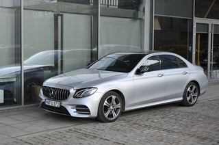 Mercedes-Benz car parked at modern office building in Vilnius