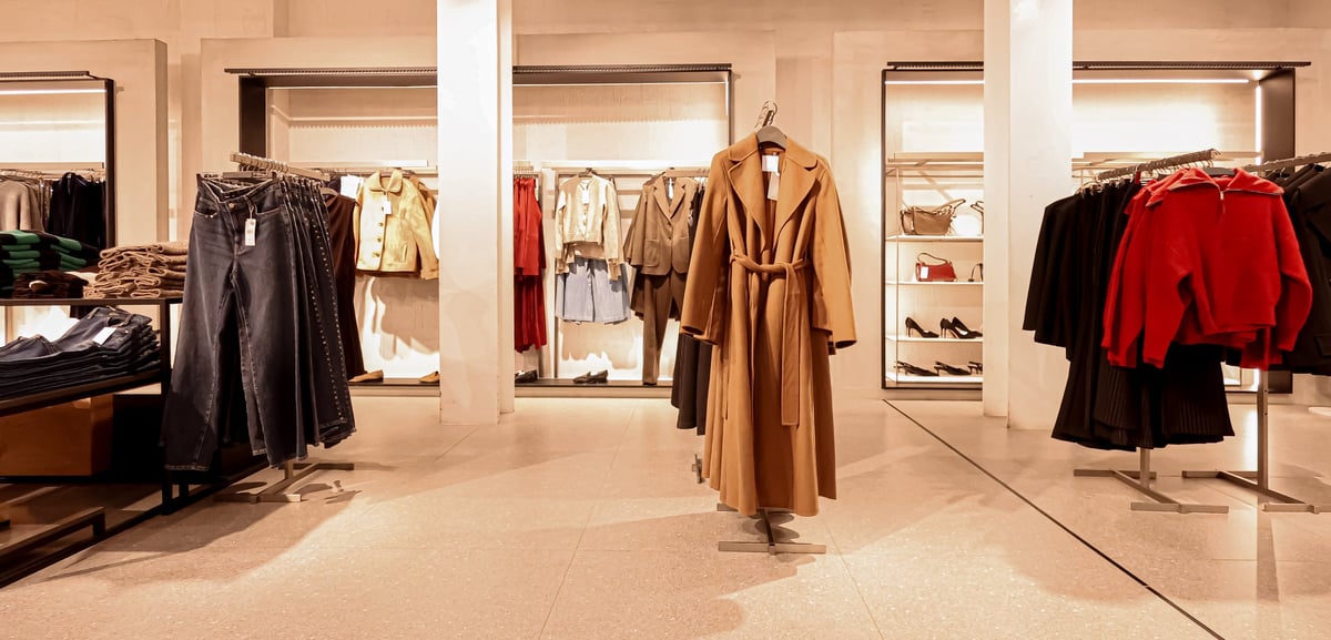 Clothing store interior with fashionable garments on display