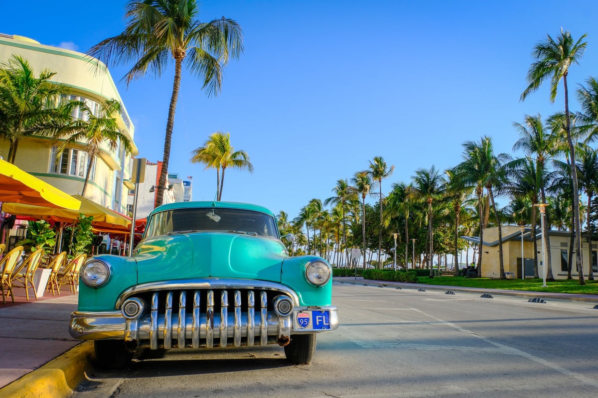 MAR 11 2026 - Miami Beach, FL, USA - Ocean Drive, the main street of Miami Beach with a vintage 1950s American car parked.
