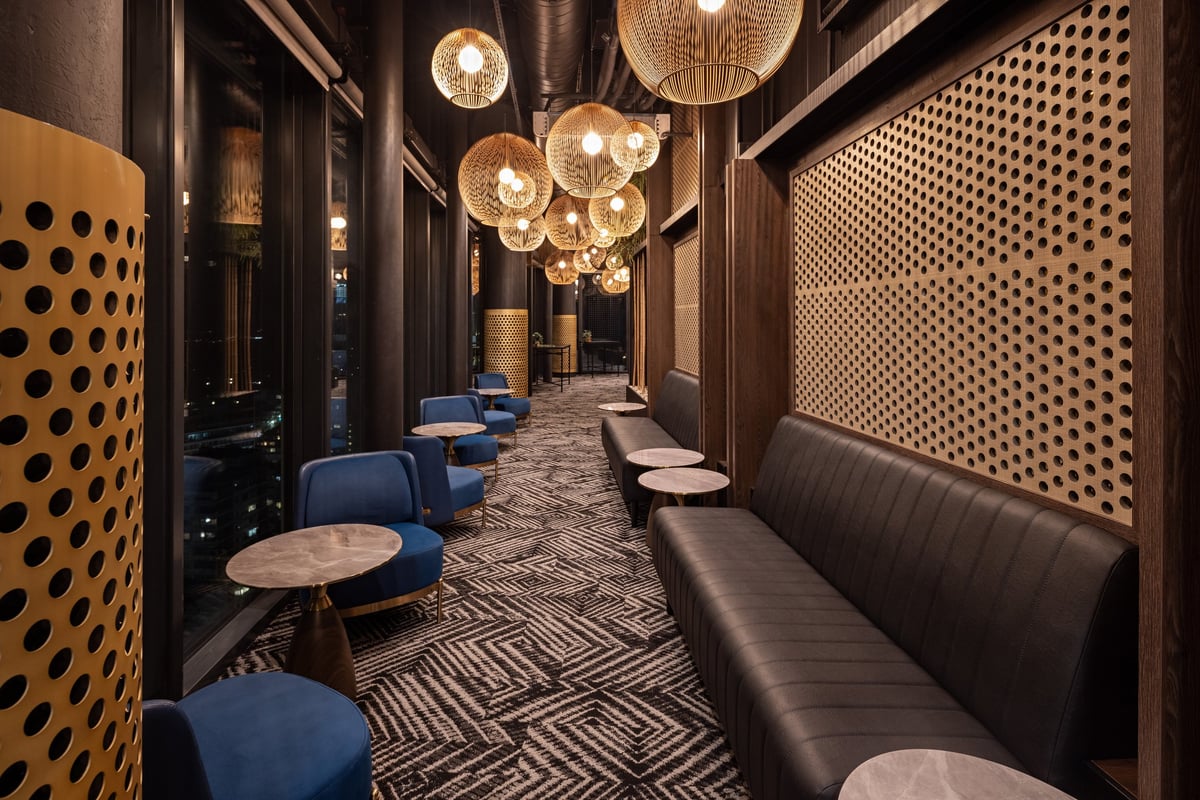 Stylish lounge interior with cozy seating and evening lighting